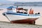 Wooden fishing boat dries ashore