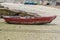 Wooden fishing boat dries ashore