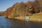 Wooden fishing boat hut in autumn landscape