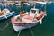 Wooden fishing boat is moored in port of Agios Sostis