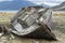 Wooden fishing boat on a rocky shore