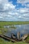 Wooden fishing boats on the edge of water-meadow