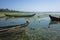 Wooden fishing boats on shore at Taung Tha Man Lake at Amarapura, Mandalay, Myanmar