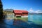 Wooden fishing hut on alpine lake