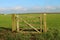 Wooden five bar gate in a field but no fence