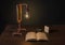 Wooden on floor, handmade copper pipe lamp, book, water bottle, cigaretta stand and lighter