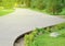 Wooden flooring - a beautiful promenade walkway for walks in the city Park on a background of green grass and trees on a Sunny