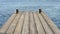 wooden flooring of the boards on the background of the sea water, the pier on sunny day, environment,