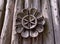 Wooden flower on antique fence