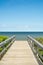 Wooden foot bridge leading towards the ocean