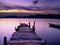 Wooden Foot Bridge and small boat at Sunset