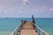 Wooden footbridge leading to the sea