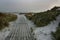 Wooden footbridge leading to the sea