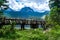 Wooden footbridge over stream against background of Meded Peak and Glacial Black Lake. Durmitor National Park. Montenegro