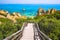 Wooden footbridge to beautiful beach Praia do Camilo near Lagos in Algarve region, Portugal