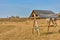 Wooden fortress in the field, old Russian wooden structure, village tower in the field