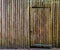 Wooden fortress wall with a doorway, exterior of a old wood fort, nostalgic architecture