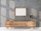 Wooden Frame Mockup hanging on concrete wall above bureau