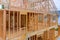 Wooden framing beams in a construction work in progress view of an unfinished house