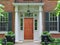 Wooden front door of house with portico entrance