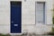 Wooden front door of restored house on french wall street facade