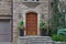 Wooden front door of stone fronted house