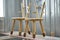 Wooden furniture. Creative child chairs made of natural wood in painting chamber