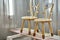 Wooden furniture. Creative child chairs made of natural wood in painting chamber