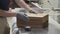 Wooden furniture details in hands of carpenter, background carpentry woodworking woodshop