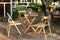 Wooden furniture set for Picnic in garden. Empty Wooden chairs and table on veranda of house. Ðžutdoor furniture for leisure time