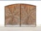 Wooden garage door with star-shaped carving