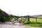 Wooden gate across a path in the countryside