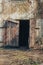 The wooden gate collapsed in the old abandoned factory warehouse