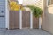 Wooden gate and fence with white concrete columns at San Francisco, California