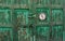 Wooden gate with green peeling paint and sign 5