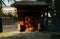 Wooden gate of old-fashioned building in sunny winter afternoon