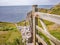 Wooden gate and stone wall on the Welsh cliff tops