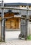 Wooden gates and wooden house.