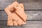 Wooden gavel on beige papers.