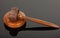 Wooden gavel on black