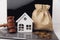 Wooden gavel, broken piggy bank and money bag. Real estate auction concept