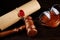 Wooden gavel and glasses near testament and last will. Notary public tools close-up