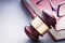 Wooden Gavel Resting on Red Leather Book