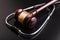 Wooden gavel and stethoscope, close-up view