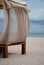 Wooden gazebo, awning canopy, transparent fabric, on the beach, beach sand morning wind