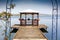 Wooden gazebo on dock over peaceful lake