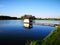 Wooden Gazebo on summer lake