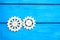 Wooden gears ,cogwheel, on a blue background, mechanism