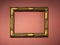 Wooden gilded frame without a photo or picture