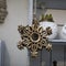 Wooden gilded star on the door as an ornament for Christmas